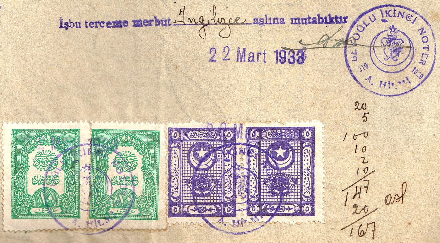 A 1933 Turkish notarial document carrying revenue stamps and an official seal.