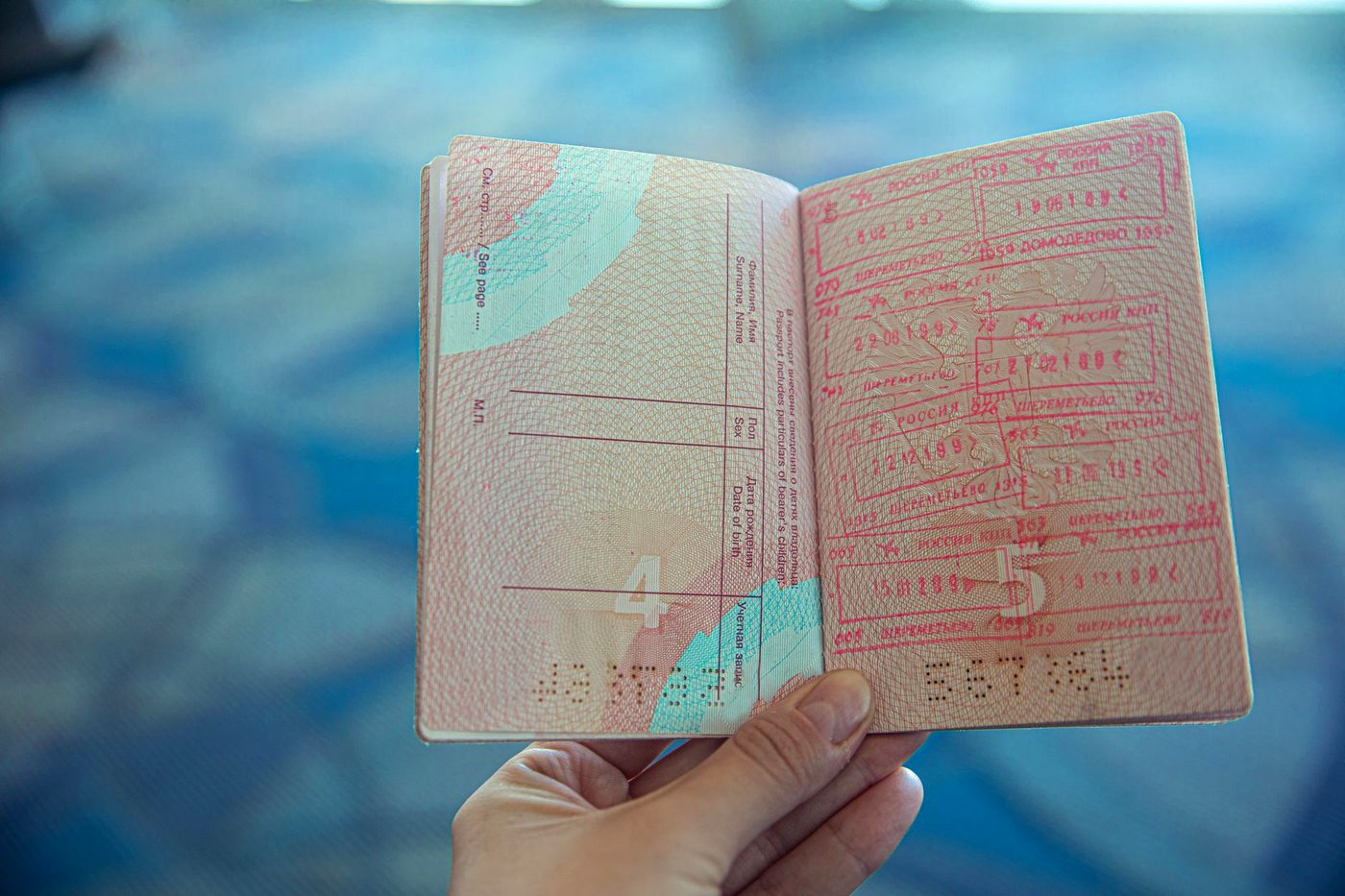 An open passport showing its photo page.