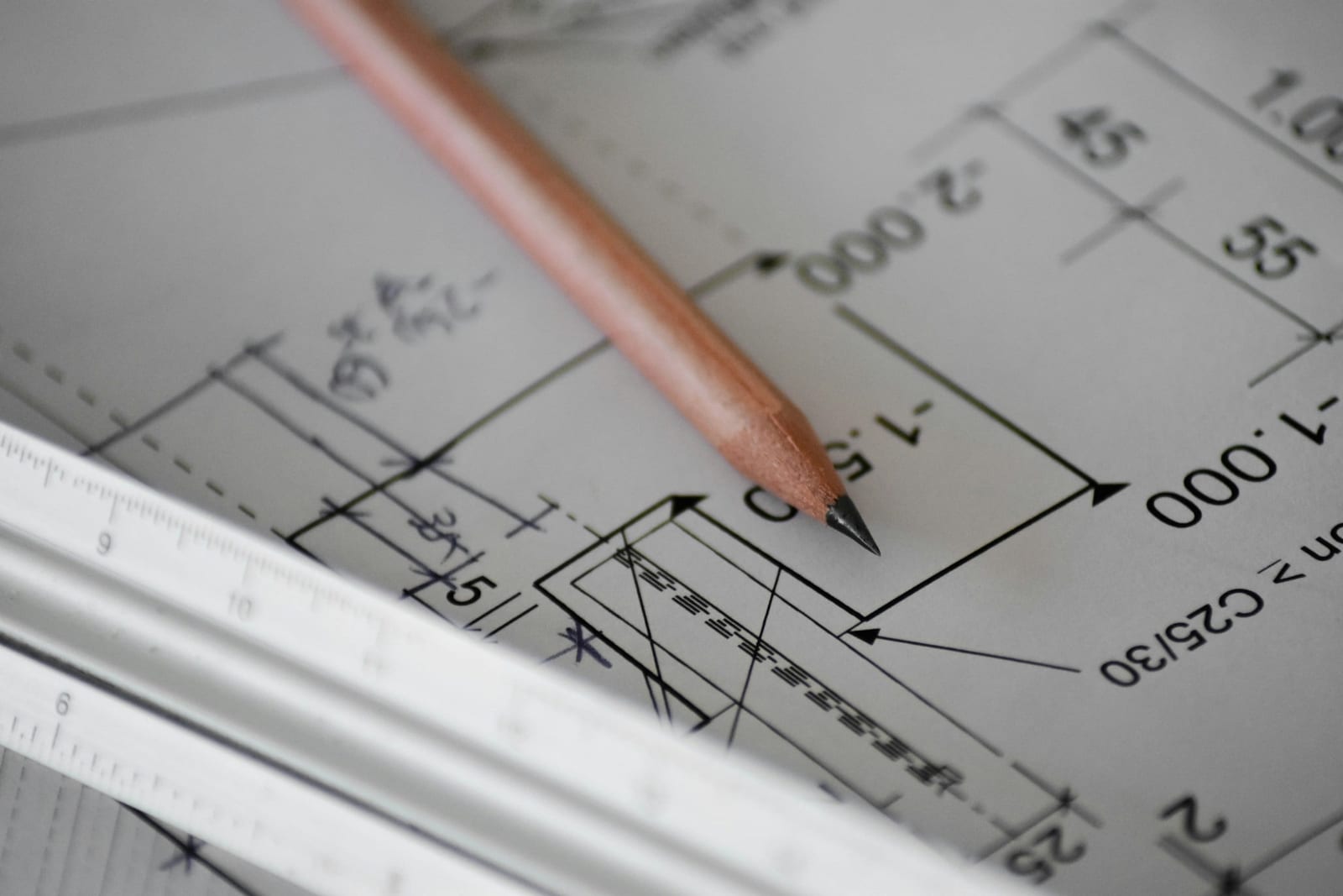 Contractor reviewing a change order and project scope on a job site.