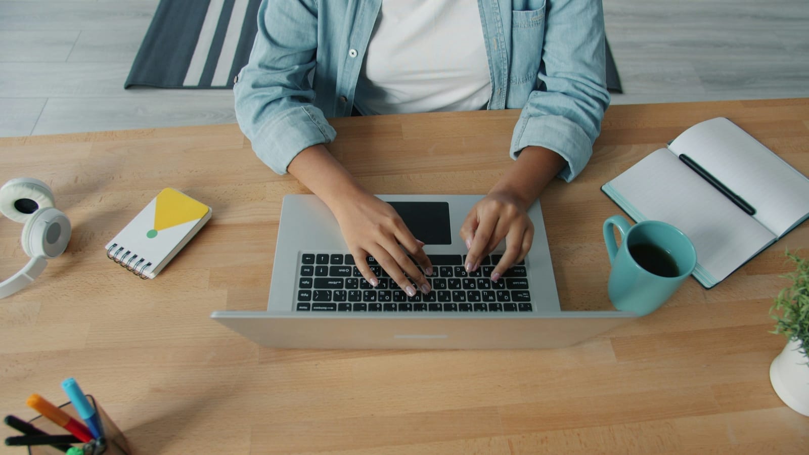 Freelancer working independently at a laptop, focused on delivering client work.